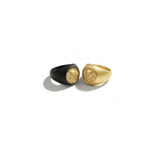Two Alison Mariot lion rings in 316L steel with black rhodium and 18K gold PVD