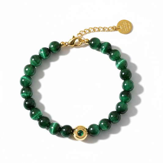 Alison Mariot evil eye bracelet in 316L steel with 18K gold PVD and green Swarovski crystals