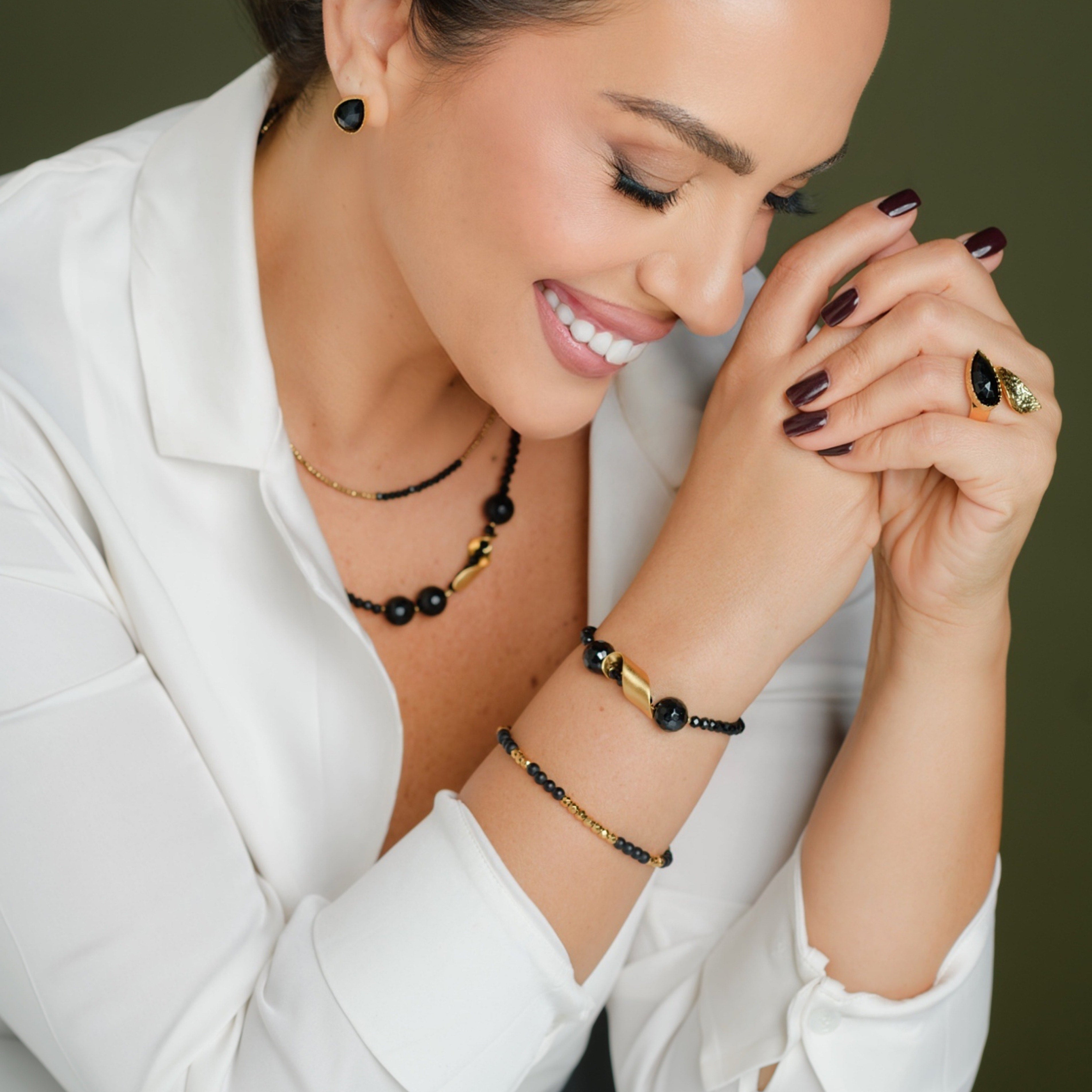 Alison Mariot Melani jewellery in 18K gold vermeil with natural black onyx