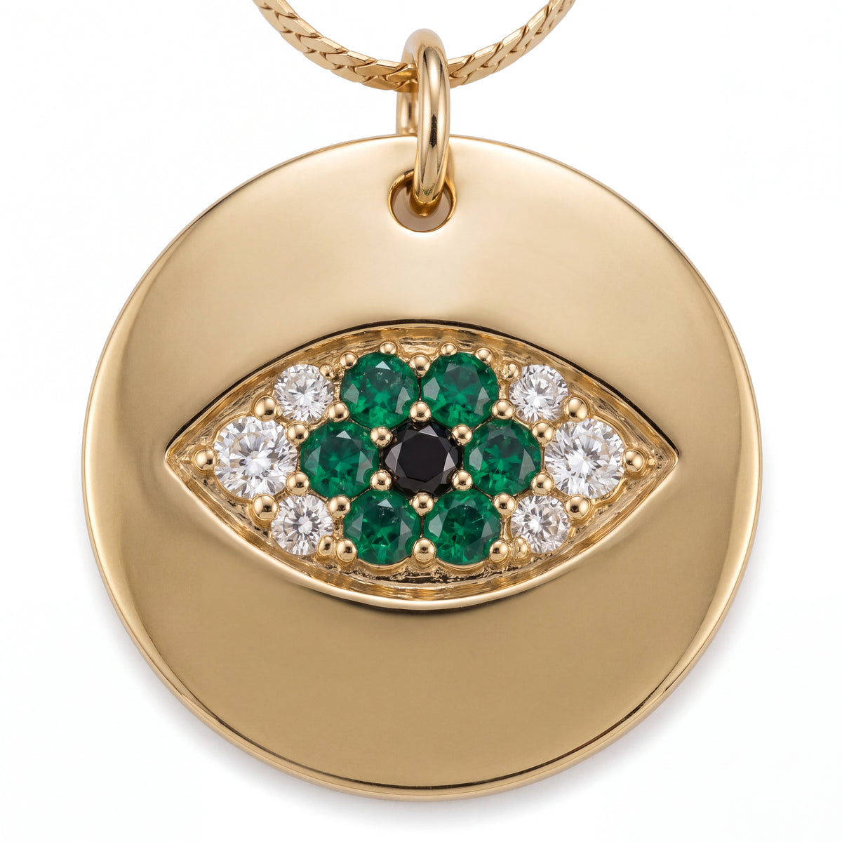 Alison Mariot Emerald evil eye pendant — close-up of the crystal eye