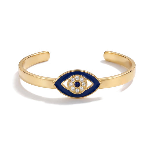 Alison Mariot Iconic evil eye cuff bracelet in 18K gold vermeil with white and blue Swarovski crystals — front view