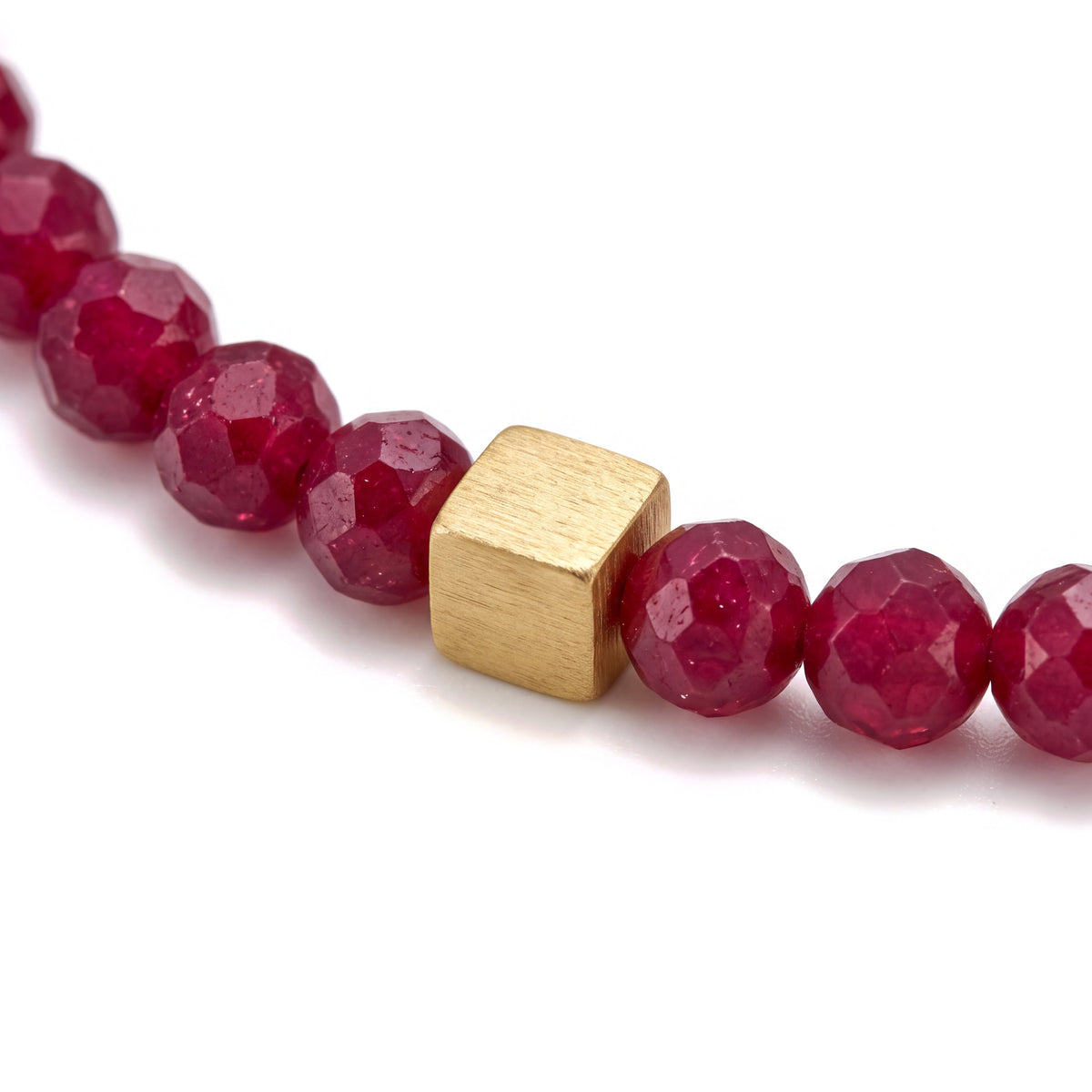 Alison Mariot Kallisti bracelet — close-up of the faceted red jade beads and gold cube