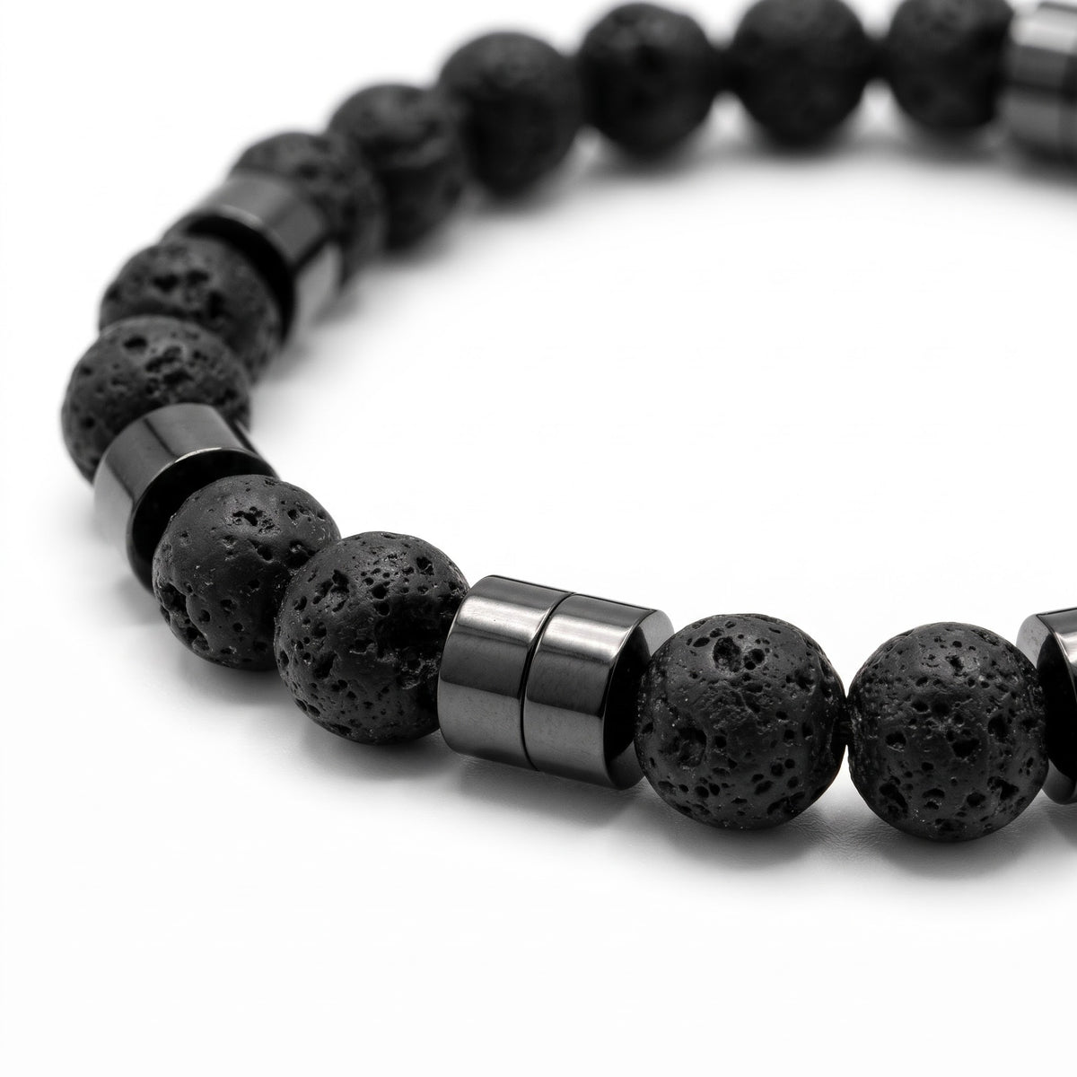Alison Mariot Essential Vulcan Black — close-up of the natural volcanic stone and black titanium spacers
