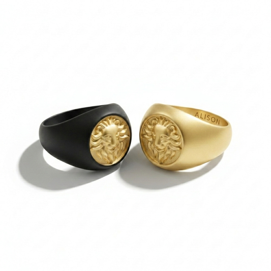 Two Alison Mariot lion rings in 316L steel with black rhodium and 18K gold PVD