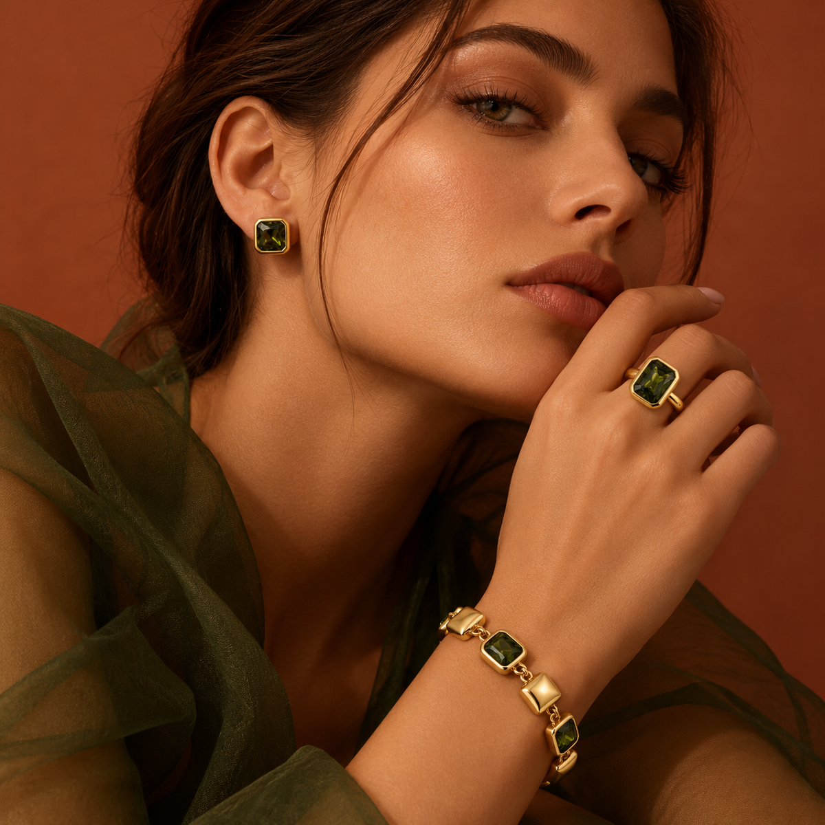 Model wearing the Alison Mariot VERDÉA ring and bracelet in 18K gold vermeil with natural green tourmaline