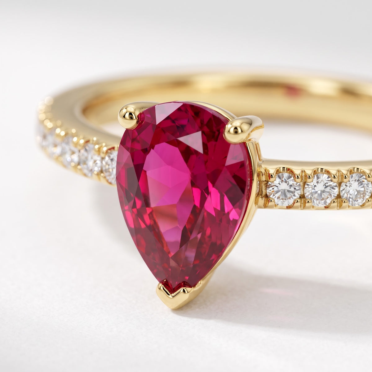 Alison Mariot AGAPI ring — close-up of the pear-cut natural red jade and pavé band
